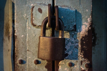 old rusty padlock on the door dirty high-resolution lock key