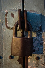 old rusty padlock on the door dirty high-resolution lock key