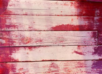 Red wooden background with shadow from fence. Close-up wall or floor wooden red plank panel or...