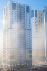 heavy fog in the city, modern high-rise buildings in the fog
