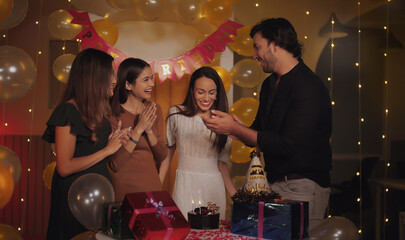 Indian happy teen female cute girl child young adult gen z man male make cake party decor light home lady group friend family sing song clap hands enjoy have fun joy day spend night time indoor house