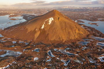 Mystical space drone view mountain and frozen lake pseudocraters. Myvatn in the north of Iceland.