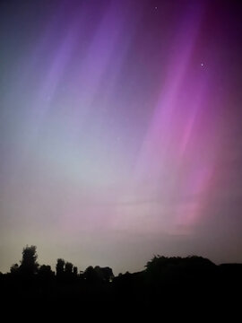 Explosion of colorful magic northern lights or Aurora Borealis in the night sky