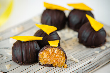 Handmade chocolate candies with fruit filling by a chocolatier