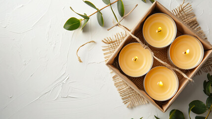 Box with wax candles on white background