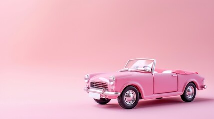 A cute pink convertible toy car for a doll showcased against a soft pink backdrop in isolation