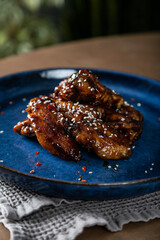 Crispy chicken wings in teriyaki sauce