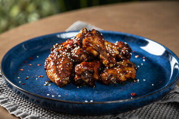 Crispy chicken wings in teriyaki sauce
