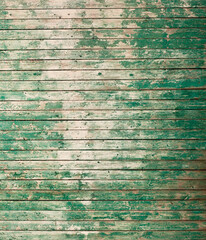 Wooden surface with remains of green paint
