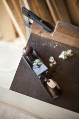Hand plane and clamp on the workbench.