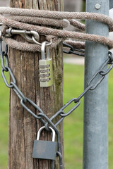 Padlock combination lock with chain on the fence