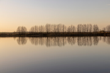 The sky and the lake are red-tinged during sunset