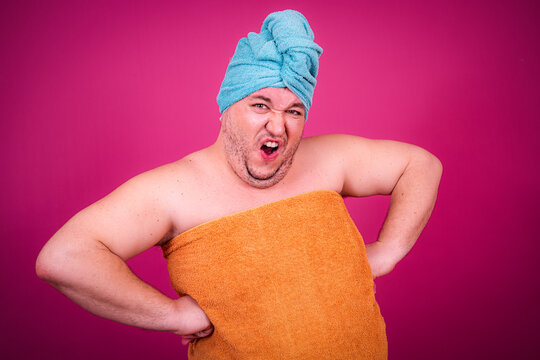 Early morning and preparation for the party. Funny fat man after a shower.