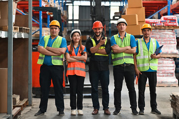 Multiracial Warehouse workers logistic team working in warehouse for industry business or shipping...
