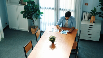 Top view of businessman preparing document for presenting marketing idea or creative startup...