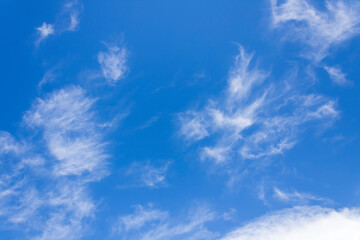 Blue sky with white cirrus clouds background