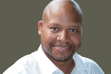 Portrait of a smiling handsome bald-headed male model 