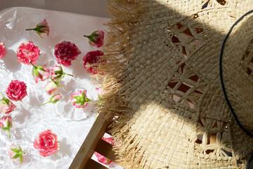 Relaxing Spa Day with Floral Bath and Straw Hat
