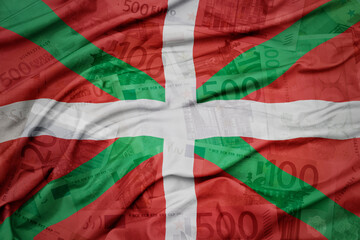 waving colorful national flag of basque country on a euro money banknotes background. finance concept.