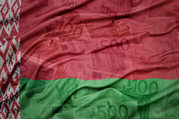 waving colorful national flag of belarus on a euro money banknotes background. finance concept.