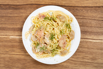 top view spaghetti with creamed mushroom and bacon sauce
