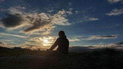 silhouette of a person in the sunset