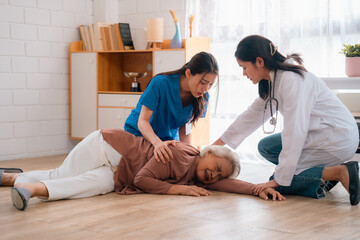 caregiver support senior elderly patient who having accident to fall on the floor at home, health...
