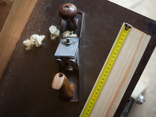 Hand plane and ruler on the workbench.