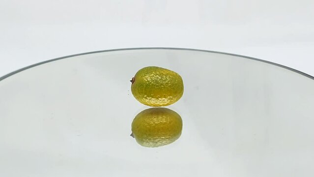 Orange rotating on a turntable