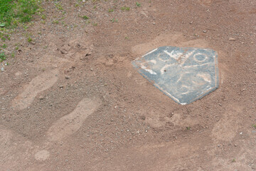 baseball plate and foot prints on infield clay