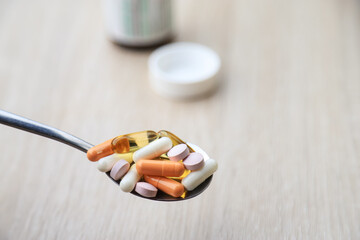 Multivitamins on spoon for healthy eating for good health living life