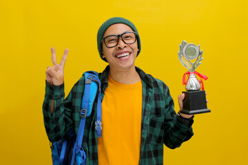 an Enthusiastic Asian student, sporting a backpack, beanie hat, and casual shirt, celebrates with a...
