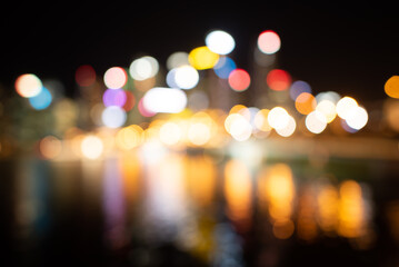 A Colorful blur and bokeh of night life light, shiny traffic, city street life, urban lifestyle...