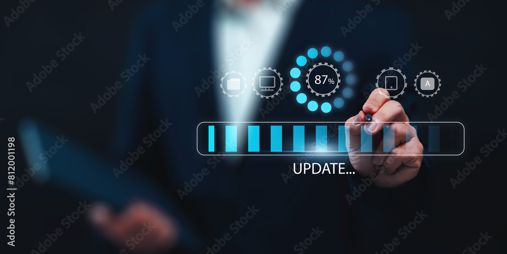 Fototapete Updating computer system software application installation for devices to be up to date with the new version. Hand interacting with graphics icon updating function screen loading on computer laptop.