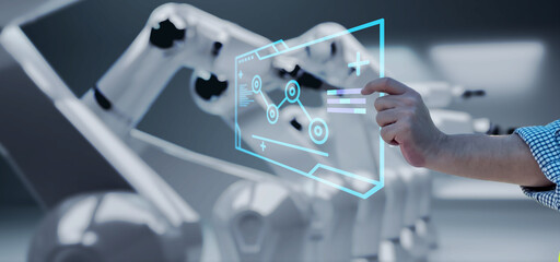 Engineer hand monitoring robotic AI arms in manufacturing factory plant, manager managing controlling using computer holographic ui display analysis technology, engineer, dark banner background.