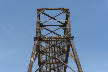 metal rail signal tower on a blue sky