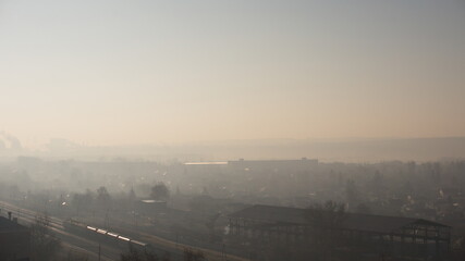 foggy day, top view of the village and the railway