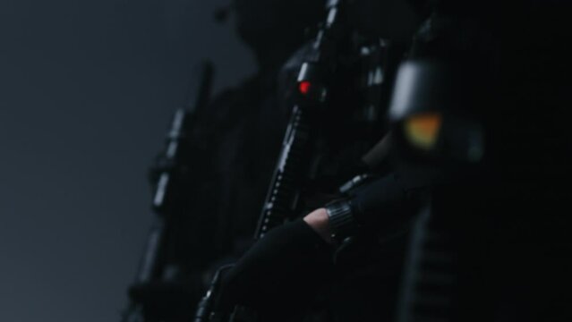 A squad of special forces armed with AR-15 rifles, fully equipped and prepared for a combat mission.