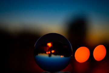 lens ball shooting ball crystal reflecting the sunset view in close-up