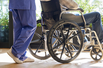 Obraz premium Push, nurse or patient in wheelchair in hospital for healthcare service, helping others or clinic support. Closeup, people or person with disability or medical care for rehabilitation or recovery