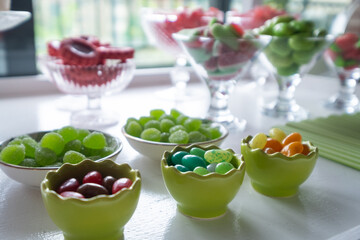 detail of a Candy table. Sweets on a festive celebration table. There are cookies, chocolates, chocolate eggs, cakes and different kind of candies