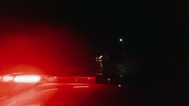 Police car in hot pursuit down the highway as a suspect attempts to evade capture. The adrenaline-filled chase unfolds as the car races away from law enforcement