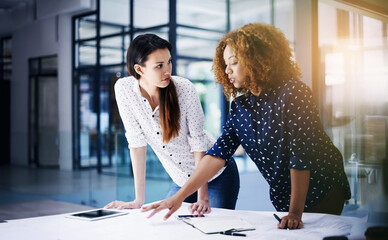 Business women, discussion and tablet with planning and website content communication with advice in office. Startup, talking and tech with seo working and project with web idea and ux design