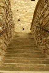 A staircase in a stone building