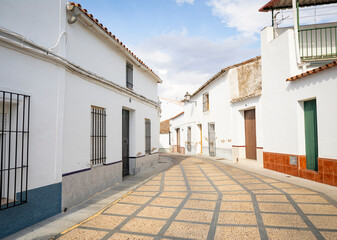 a street with typical white houses in Valencia del Ventoso, comarca of Zafra - Rio Bodion, province of Badajoz, Extremadura, Spain