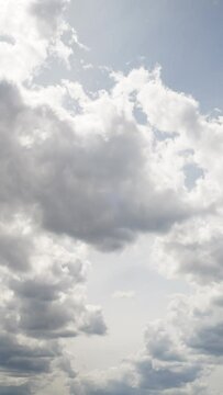 Time lapse of generation and movements of delicate clouds. Video in vertical format.