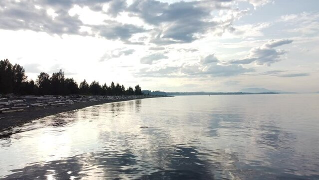 Vancouver Island tracking shot over calm water during high tide near Campbell River British Columbia Canada.
