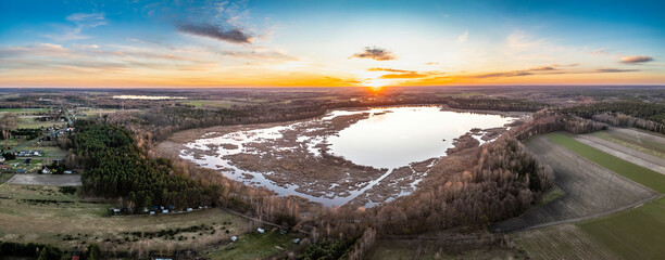 Sunset over the lake. View from the drone.