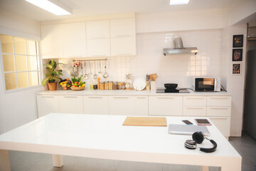 New kitchen in modern luxury clean home, Minimal light kitchen interior. White furniture with...