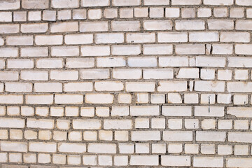 Old brick white color wall background. Light stone texture